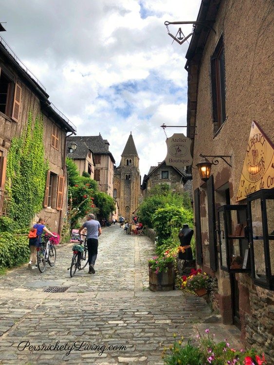 Cobbled street & stone buildings in Conques, France