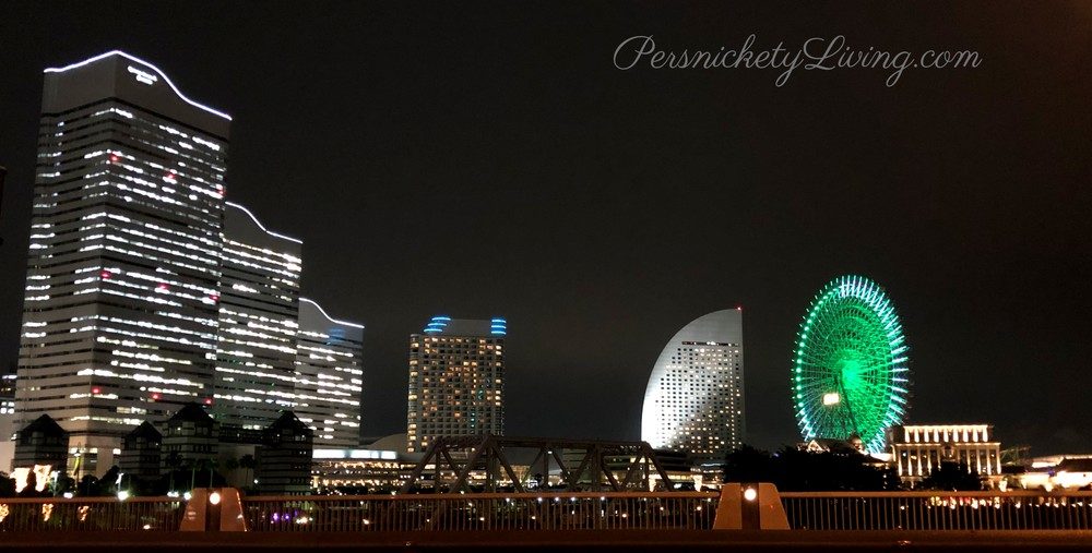 Yokohama skyline at night with buildings and green ferris wheel