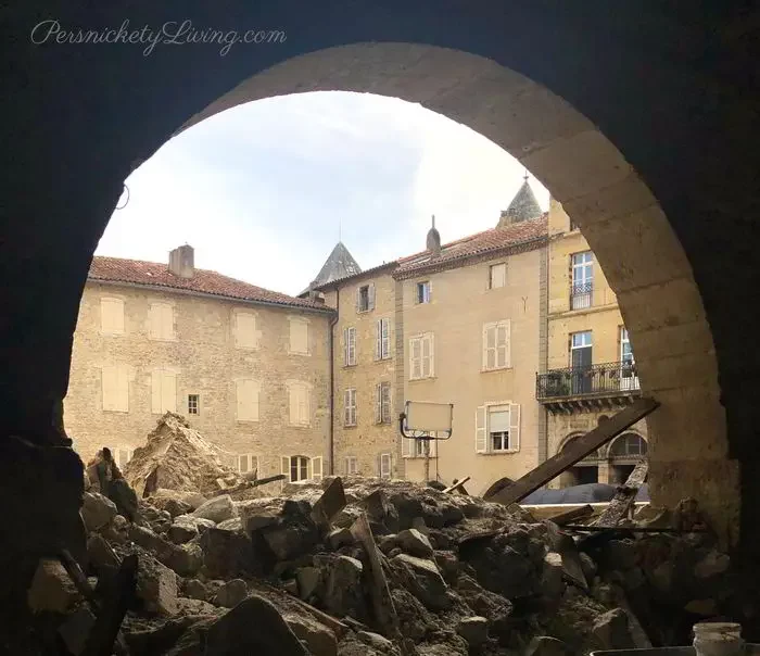 Rubble blocking an arch walkway in All the light we cannot see