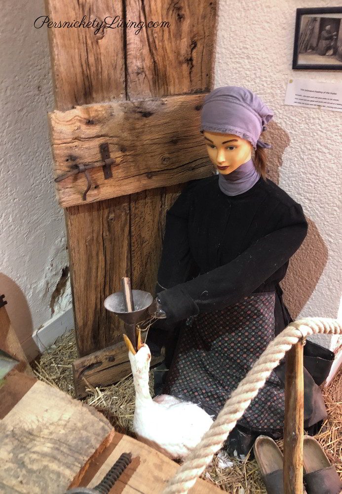 female mannequin force feeding a goose foie gras museum villefrance de rouergue