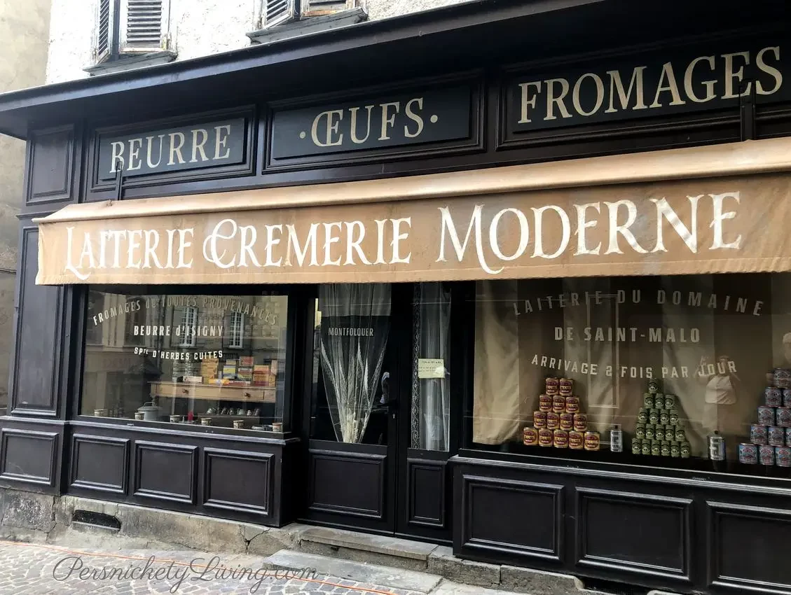Storefront with french writing Laiterie Cremerie Moderne used for All the Light We Cannot See film location