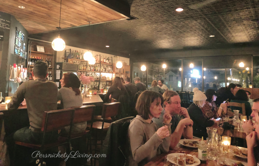 Full tables and bar, people eating at the Beer Plant vegan austin texas