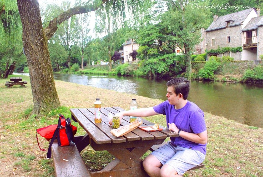 Picnic by the Aveyron River in French town Belcastel
